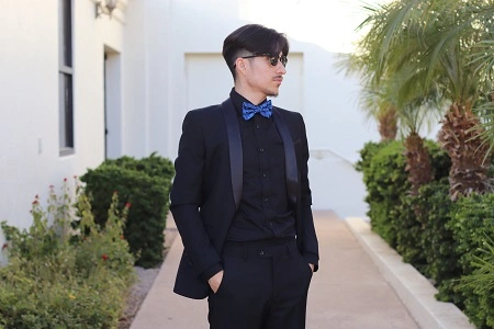 Man in black suit with blue bow tie – Van Allan’s Men’s Fashion Phoenix