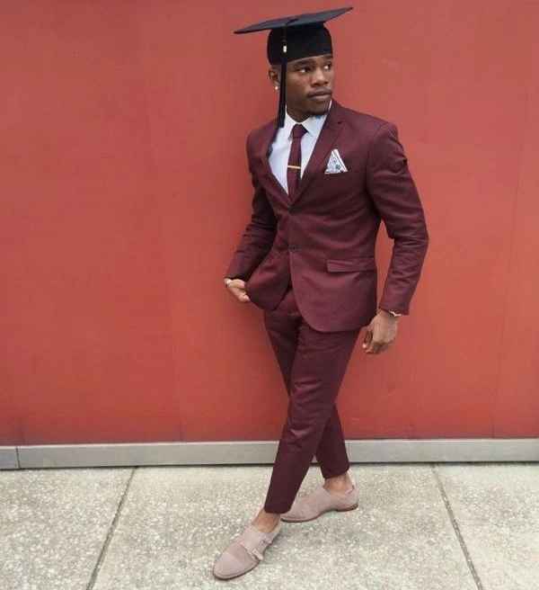 Man in burgundy suit posing in graduation outfit – Van Allan’s Men’s Fashion Phoenix