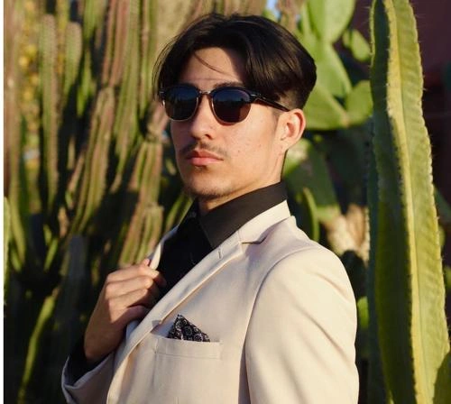 Man wearing light beige suit and sunglasses – Van Allan’s Men’s Fashion Phoenix