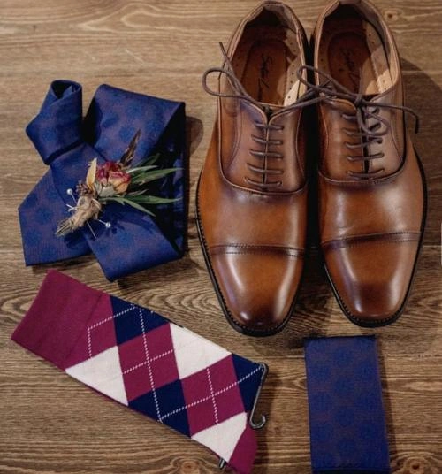 Men’s accessories flatlay with brown shoes, ties, and belt – Van Allan’s Men’s Fashion Phoenix