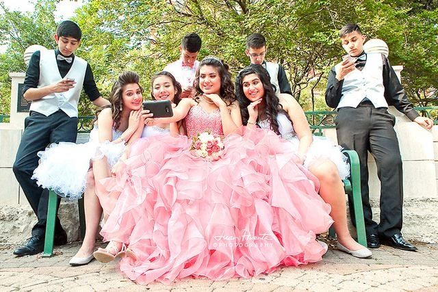 Quinceañera group with girls in pink dresses and boys in formal suits – Van Allan’s Men’s Fashion Phoenix