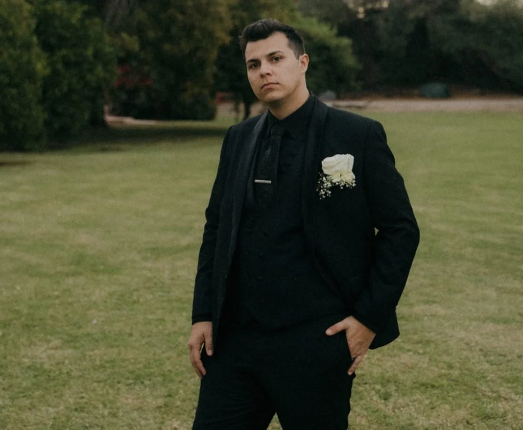 Phoenix Groom Perfect Suit Fit Groom Wearing A Perfectly Tailored Black Wedding Suit At An Outdoor Arizona Venue.